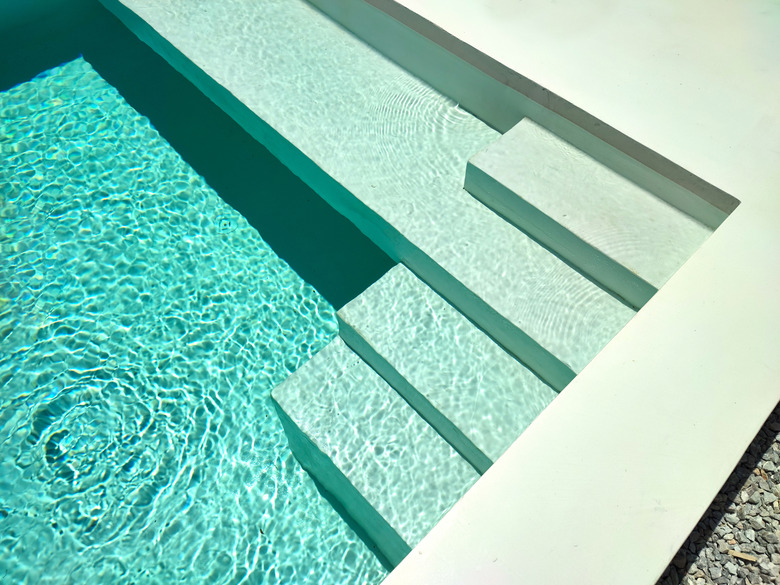 Stairs In Pool With Blue Water