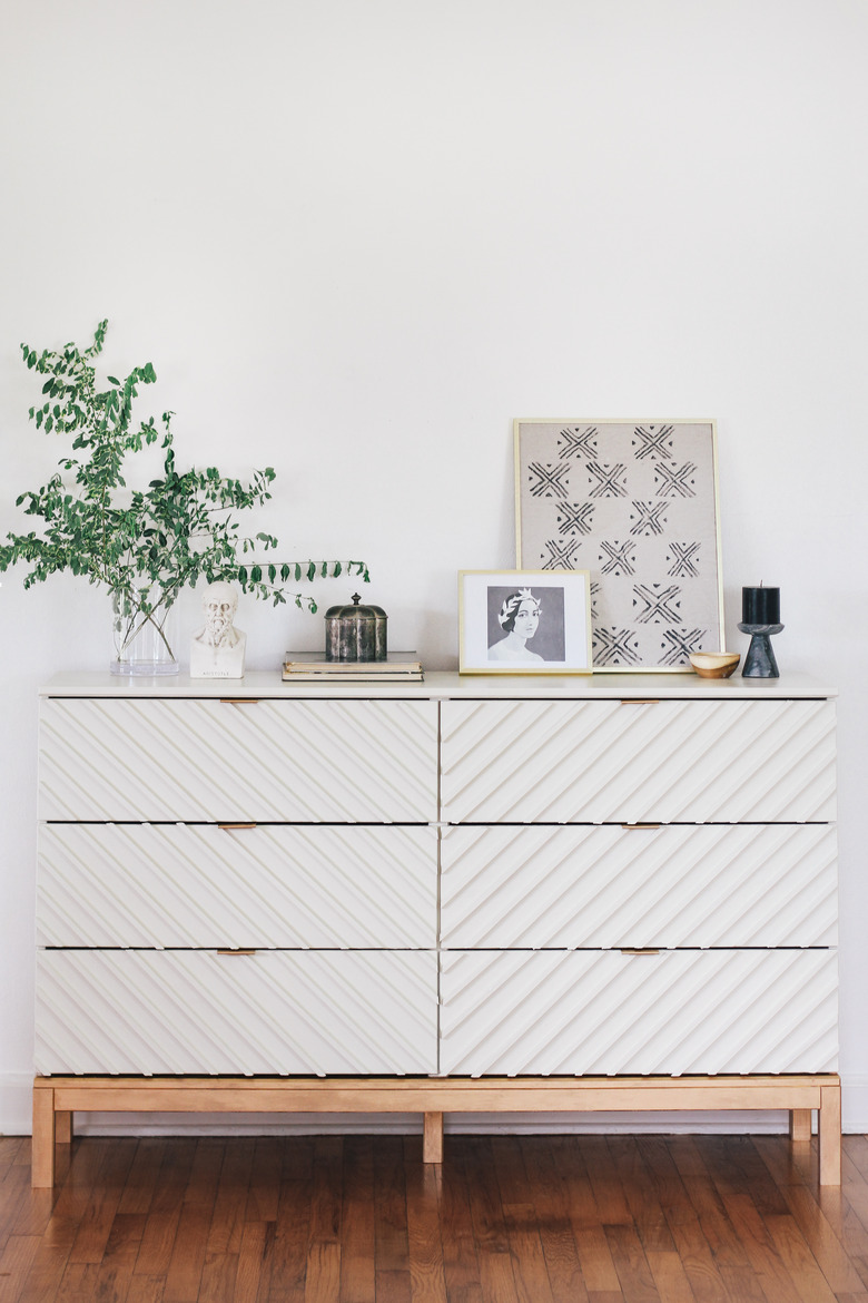 ikea hack featuring Tarva six-drawer dresser turned into a chevron dresser with wooden dowels