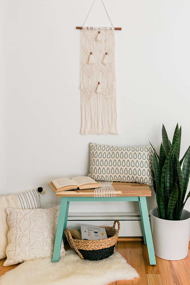 ikea hack of IKEA Skogsta Bench turned into accent bench with light green legs