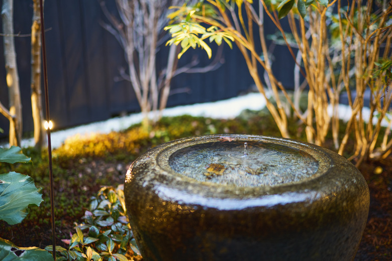 Japanese style courtyard of a machiya hotel in Kyoto, Japan.