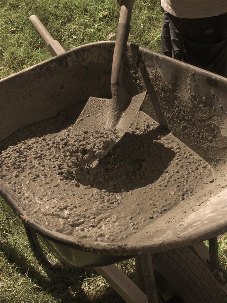 mixing concrete in a wheelbarrow