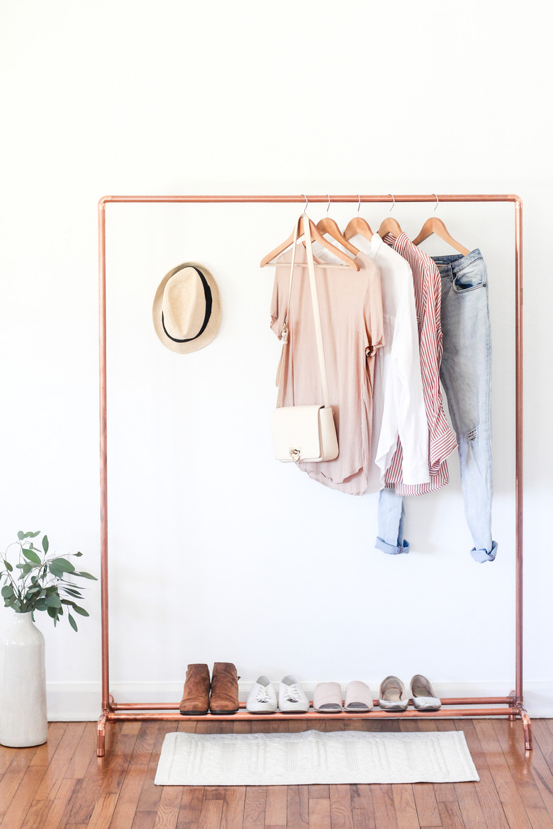 How to Organize Clothes with diy copper clothes stand in minimal bedroom