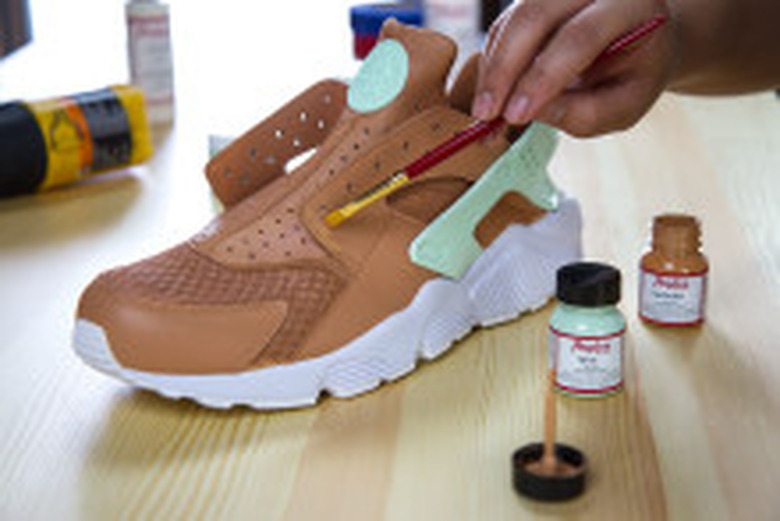 Painting leather shoes.