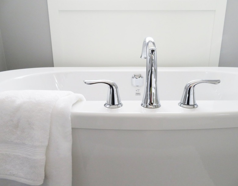 White bathtub with a white towel