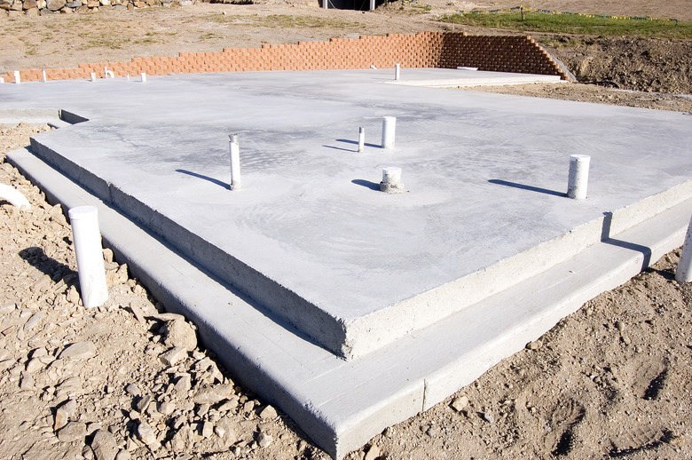 An empty concrete slabs on a dirt lot