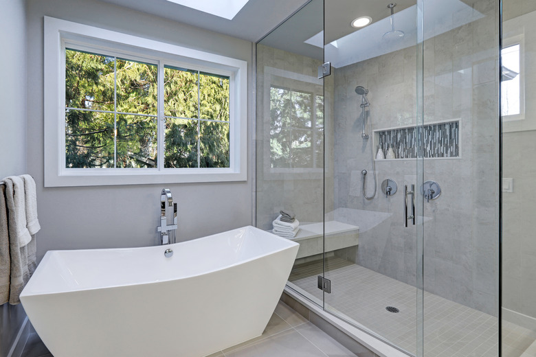 Glass walk-in shower in bathroom of new luxury home.