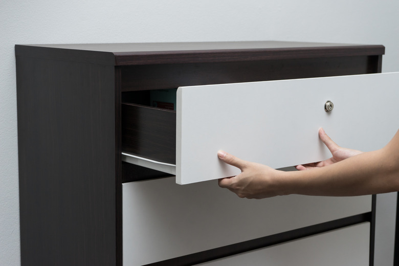 Woman hand open drawer ,wardrobe