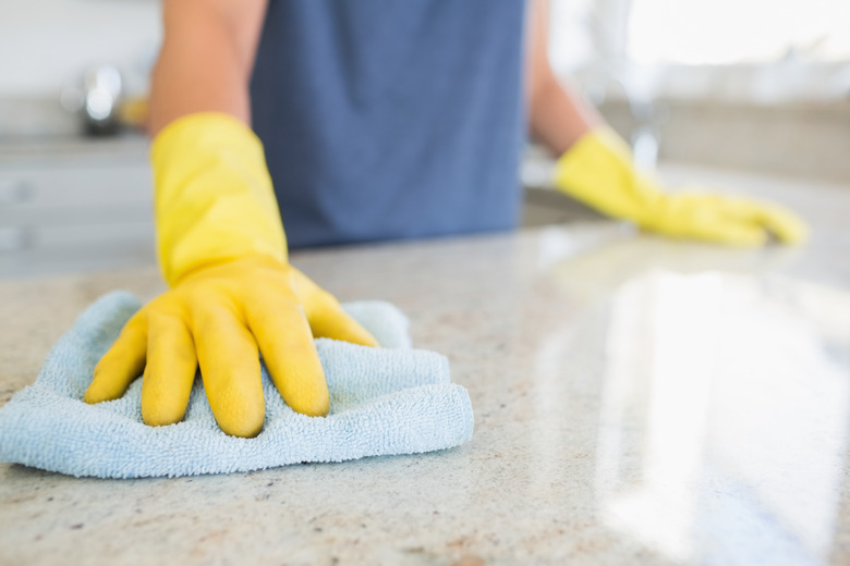 Woman cleaning the counter