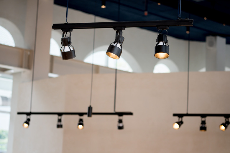 Spotlights under the ceiling on the wall decoration in cafe