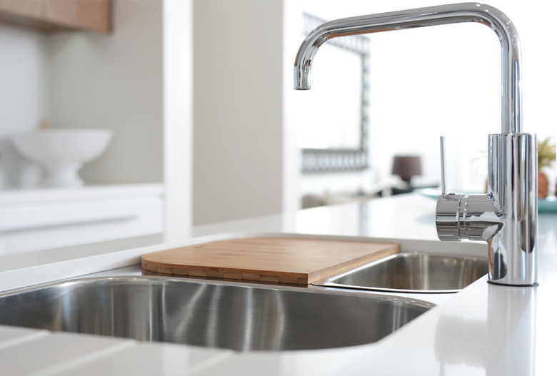 Stainless steel sink with chrome faucet