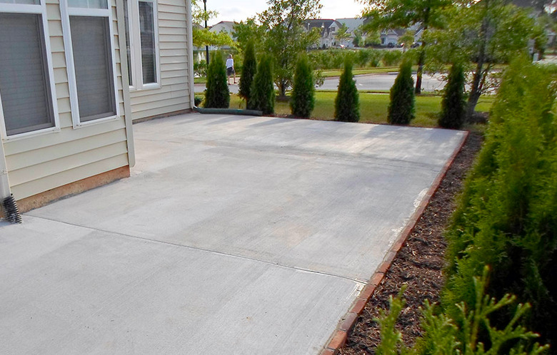 Clean, resurfaced concrete patio.