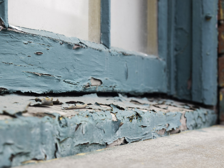 Peeling paint on old window sill