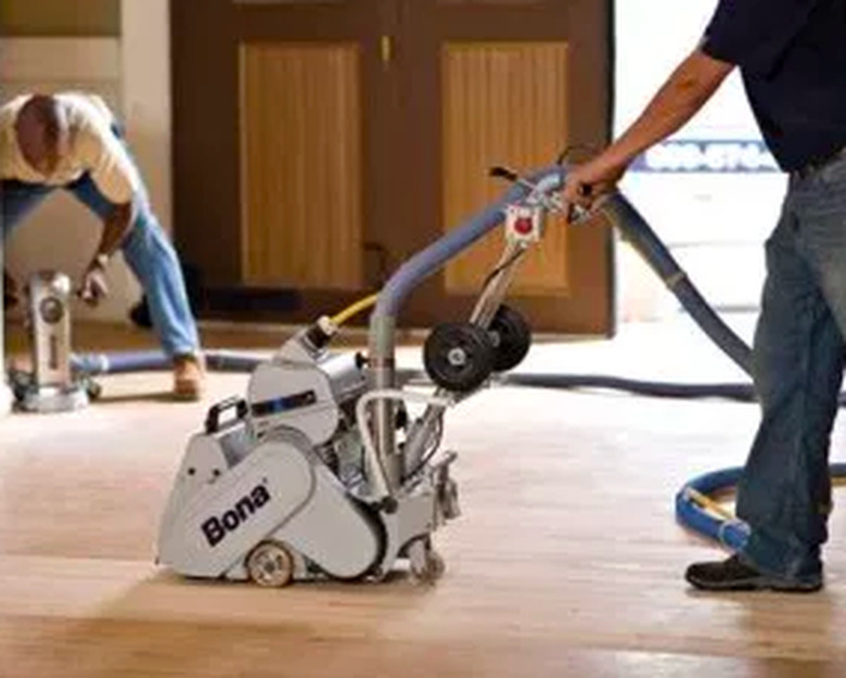 Sanding with a drum sander.