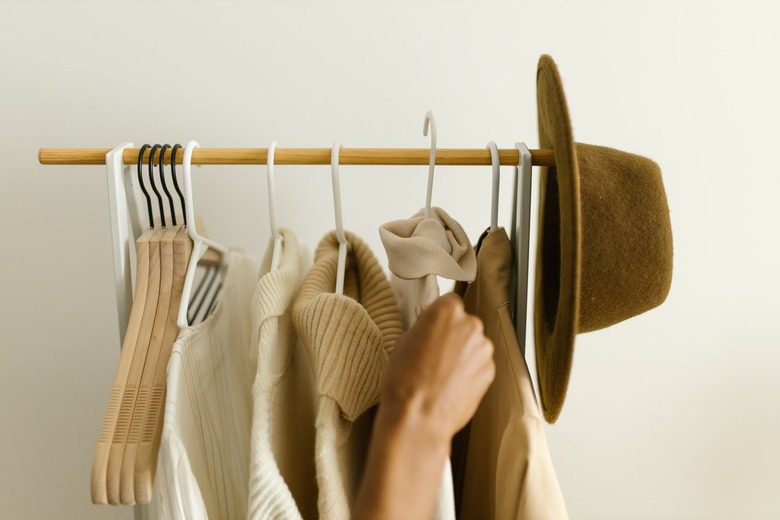 Hangers with clothes on a clothing rack