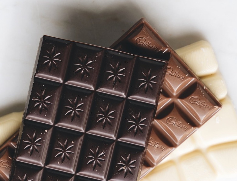 dark, milk, and white chocolate bar on white background