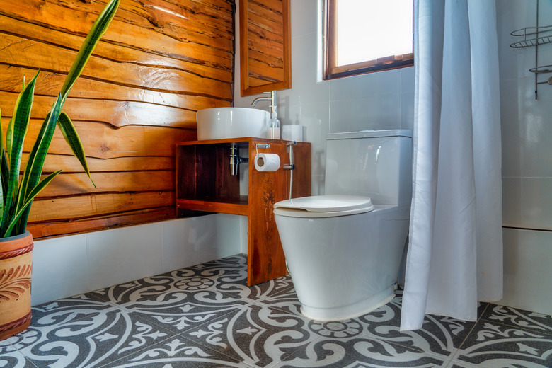 Old meets new modern bathroom with wood paneling wall