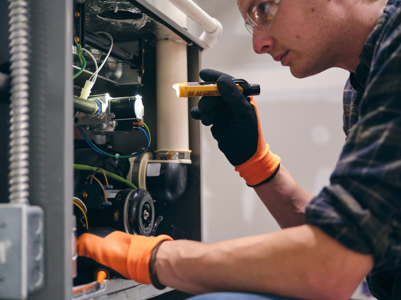 Home Repairman Working on a Furnace