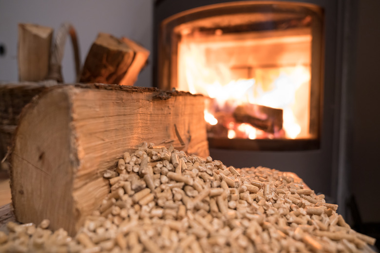 Wood stove heating with in foreground wood pellets