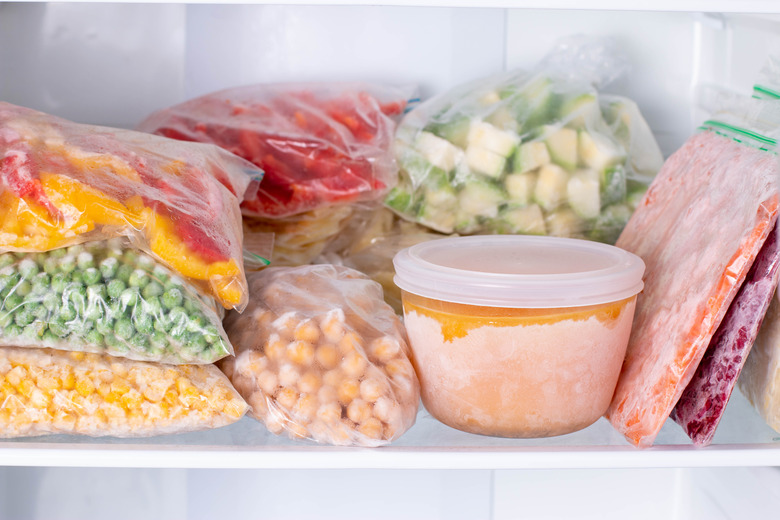 Frozen food in the freezer. Frozen vegetables, soup, ready meals