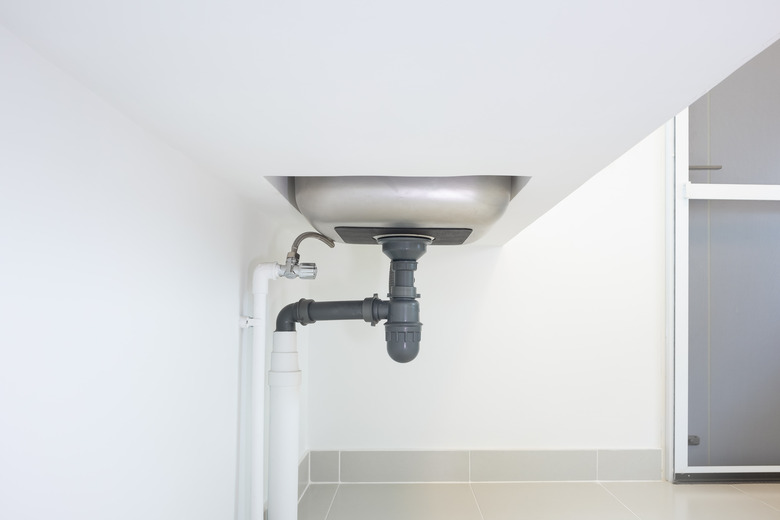 Drain pipe or sewer under kitchen sink for drain water and waste.