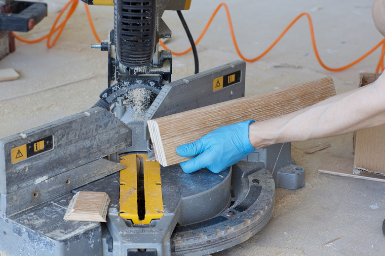 Woman wants to cut a piece of plinth.