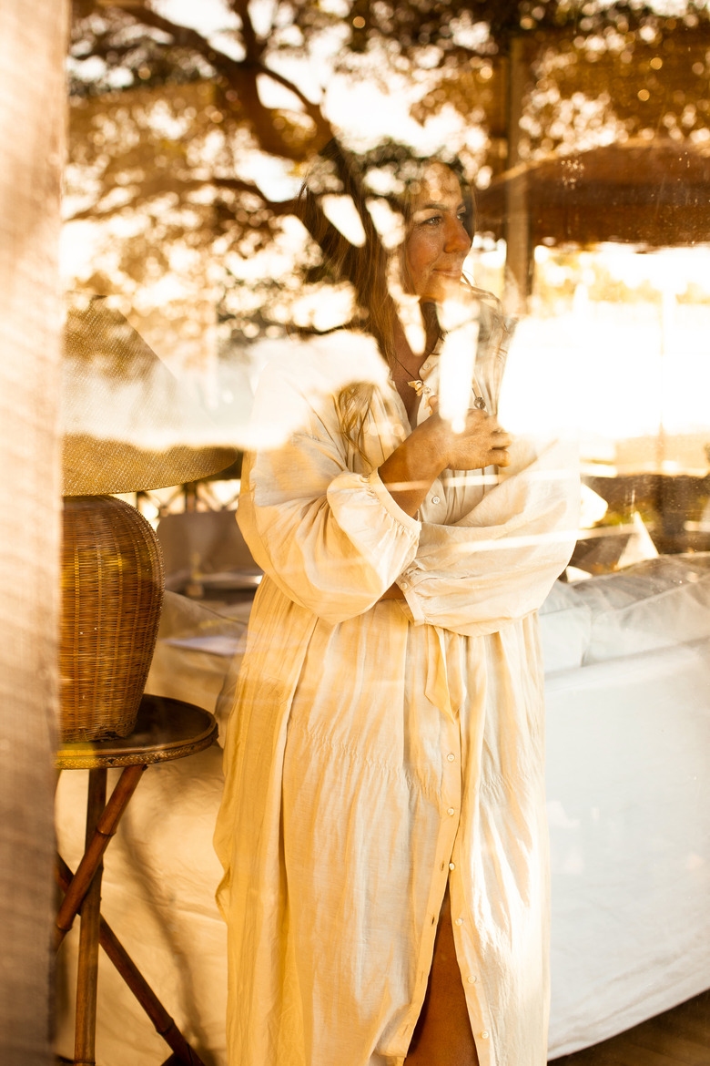 Kara Rosenlund standing in window at home