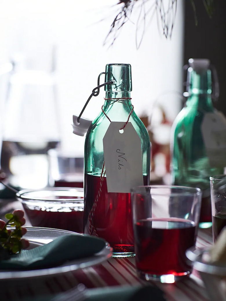 table with green bottles with stoppers