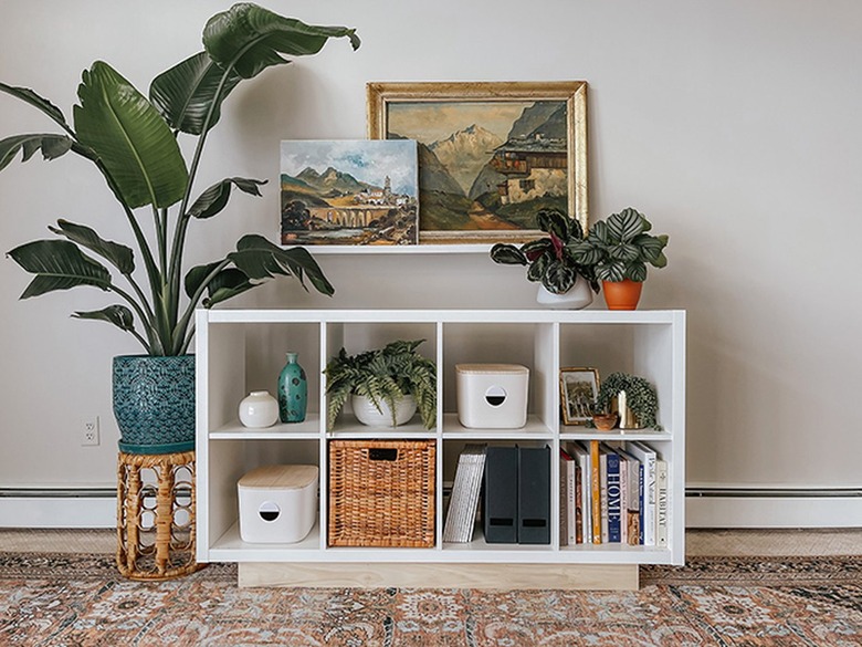 Add style to your IKEA Kallax shelf using wood and wallpaper.