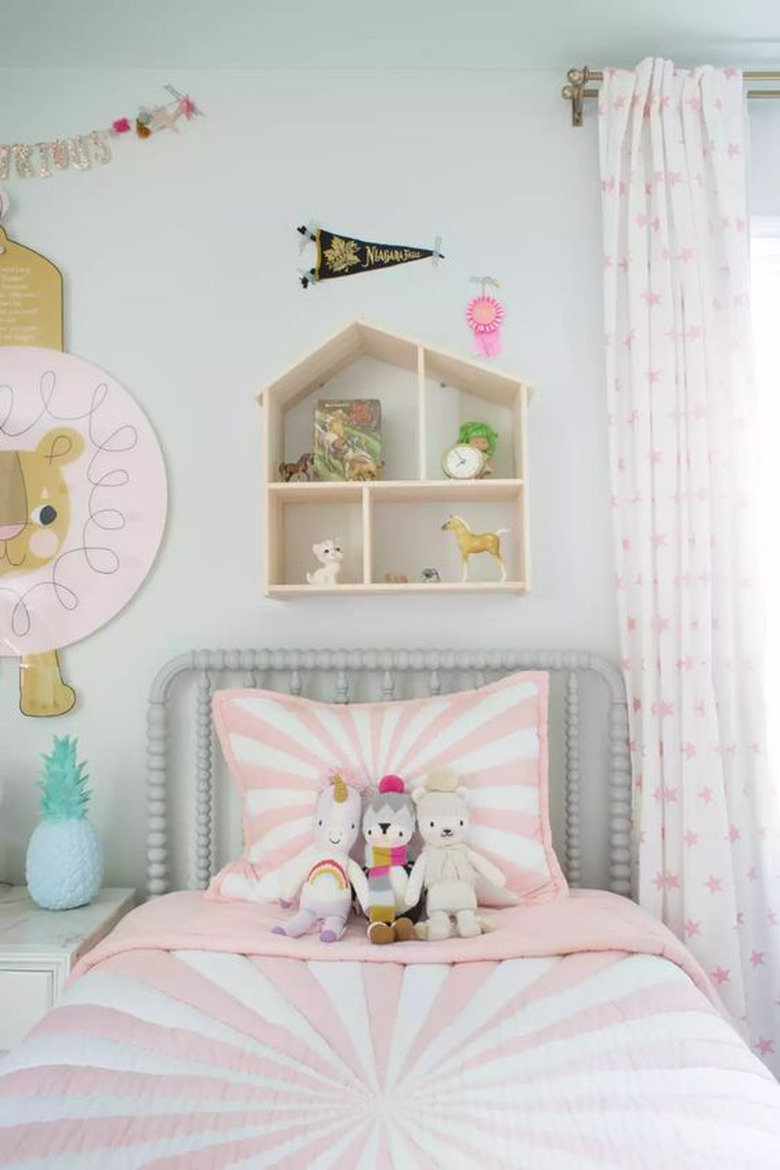 IKEA kids' bedroom idea with doll house wall shelf, pinks, and whites