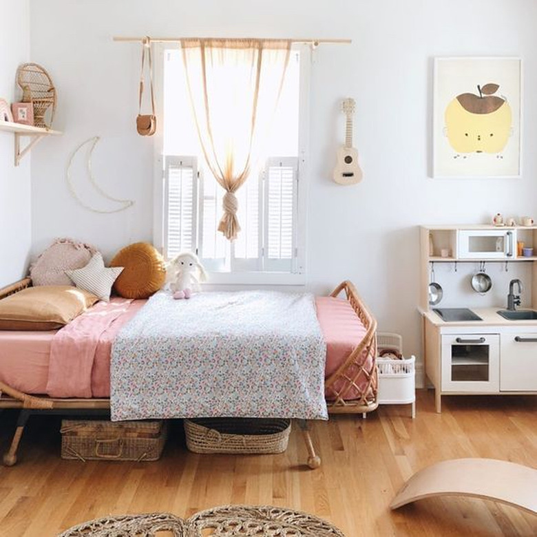 IKEA kids' bedroom idea with play kitchen and neutral color palette with pops of pink