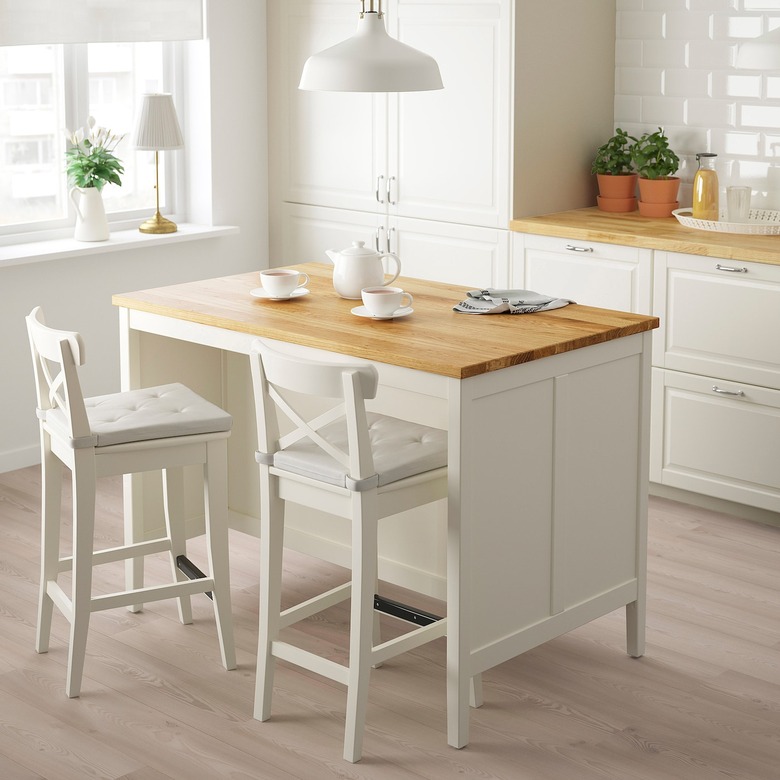 White and oak IKEA kitchen island in modern white kitchen