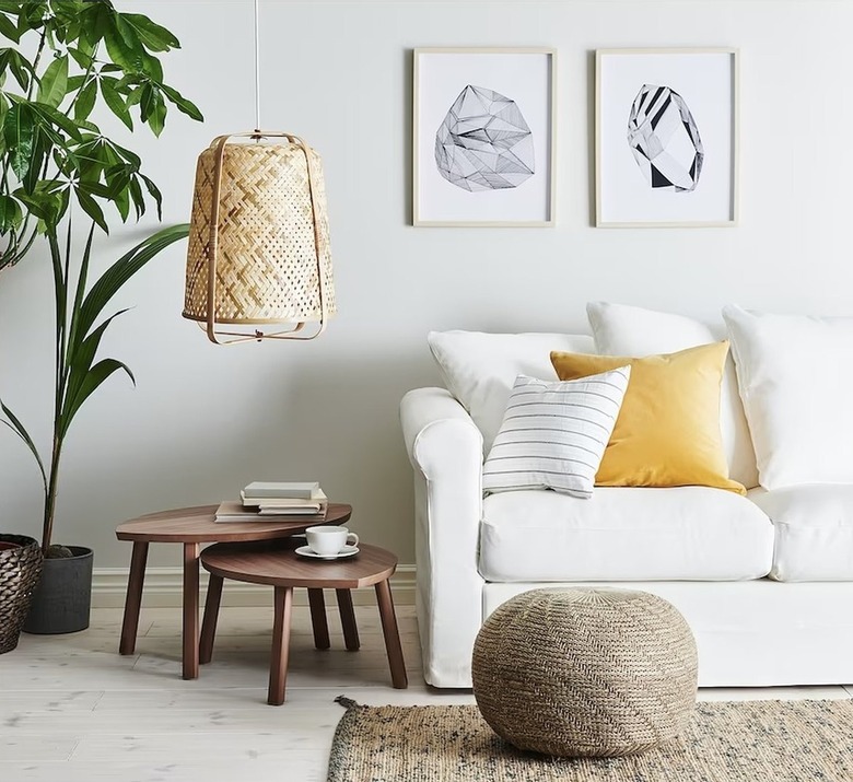 ikea living room with white sofa and jute rug