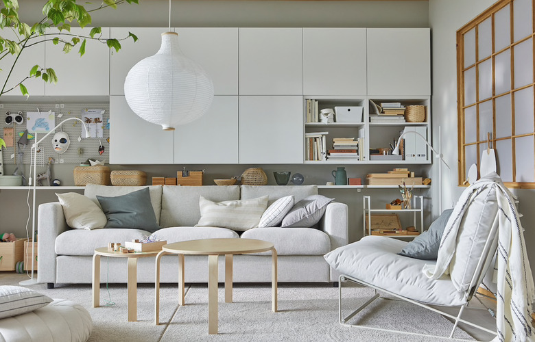 IKEA living room minimalist furniture in beige living room with with white storage cupboards