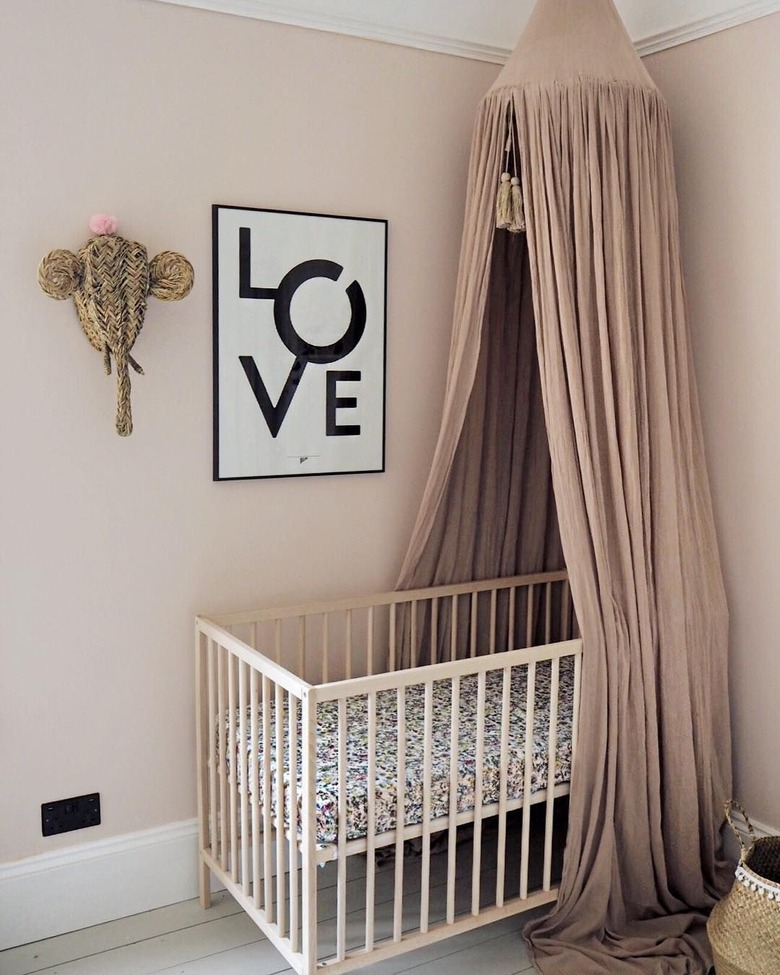 pink nursery idea with IKEA canopy over crib