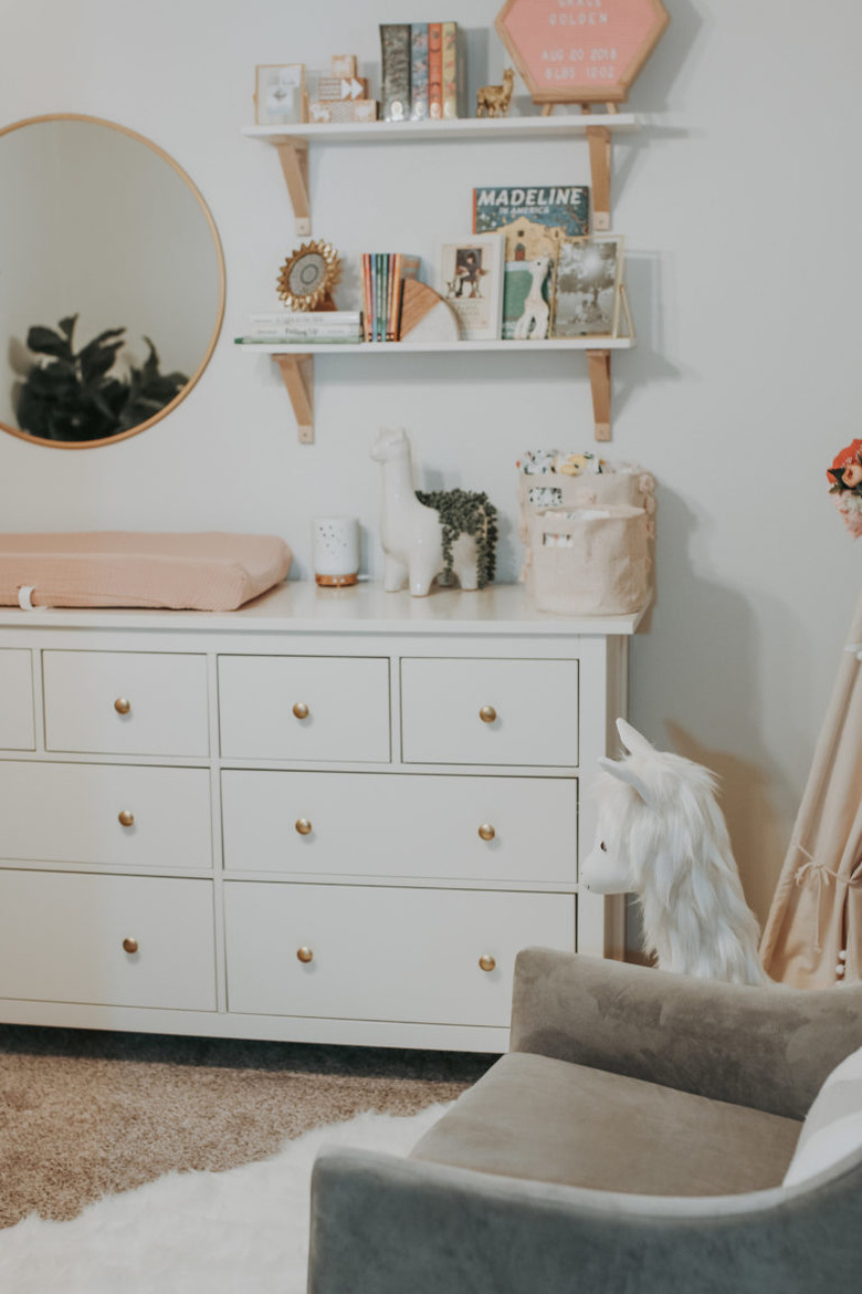 Nursery idea with IKEA dresser and shelving above