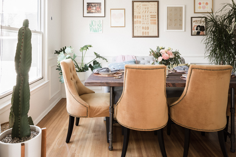 dining room with plants and art on wall