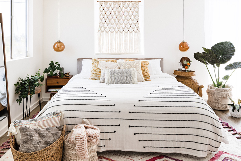 bedroom with boho decor and plants