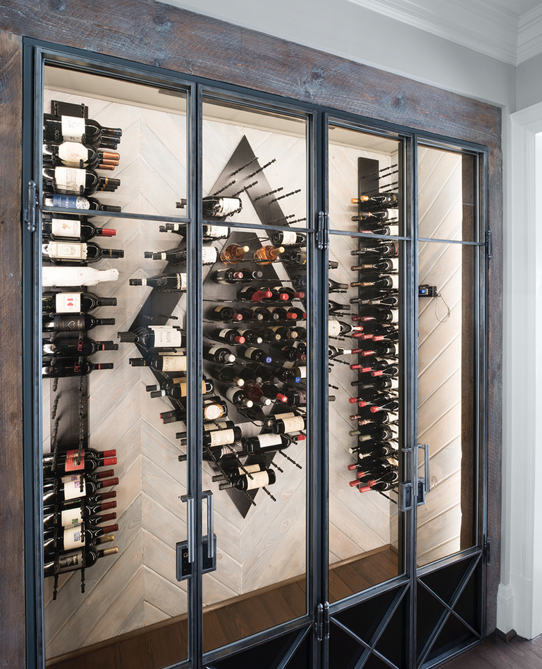 Industrial metal and wood wine cellar in industrial basement