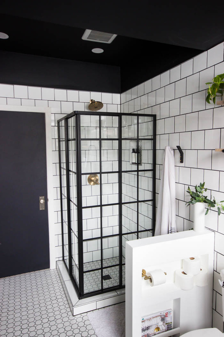 Industrial Bathroom Storage in white tiled industrial bathroom with black ceiling and clever storage