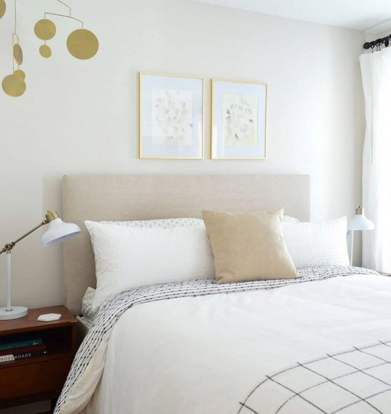 neutral guest bedroom with white bedding