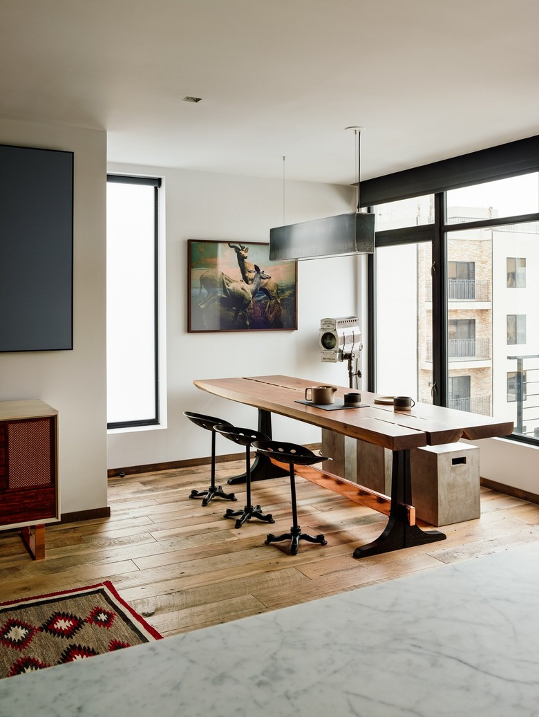 white industrial color palette in dining room with walnut table and steel paned windows