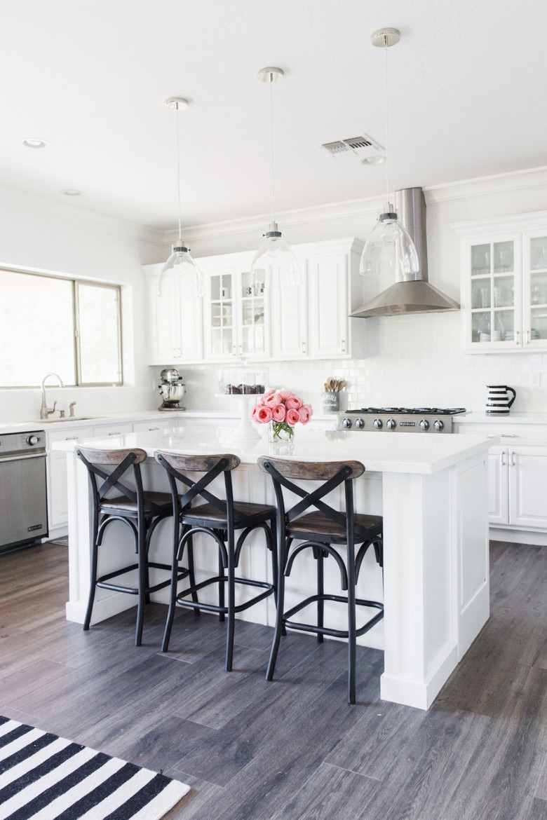 white industrial farmhouse kitchen with stainless steel finishes