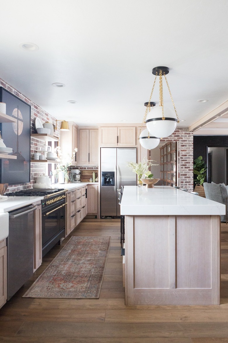 exposed brick wall in industrial farmhouse kitchen