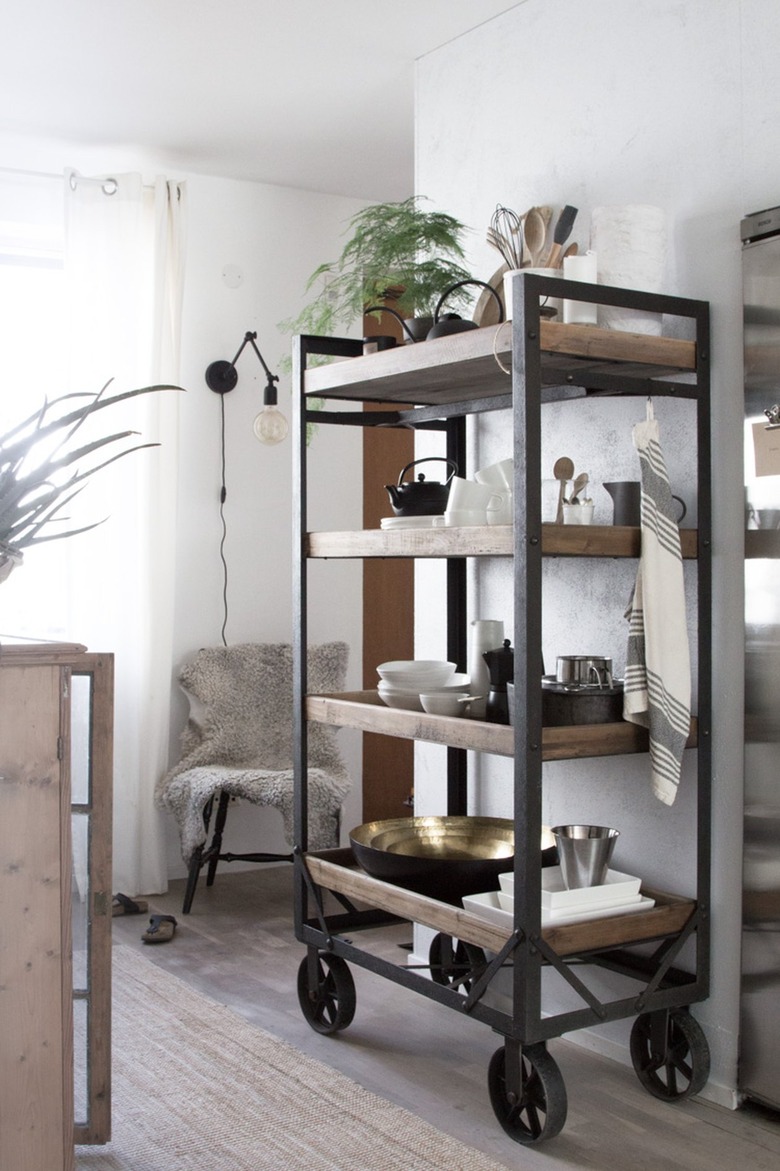 industrial kitchen with wood and metal storage cart