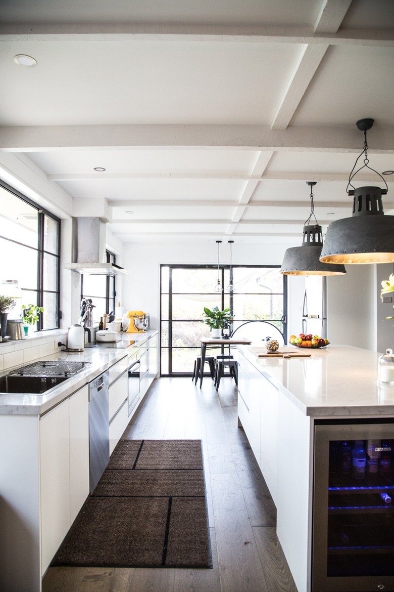 industrial kitchen with oversized metal pendants