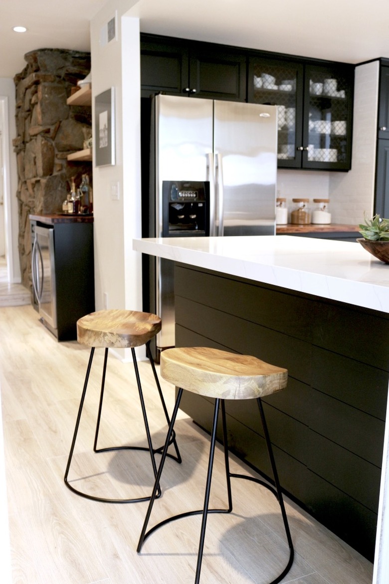 metal and wood bar stools in black industrial kitchen