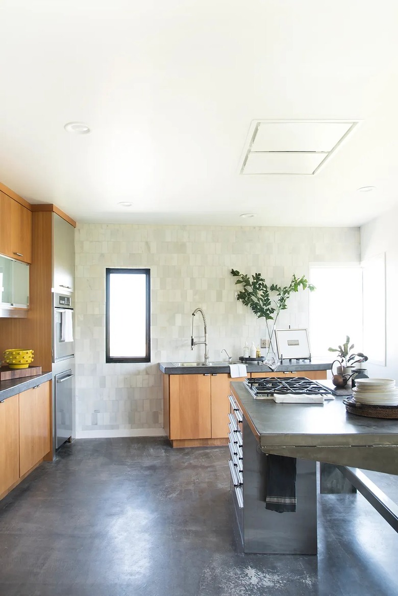 minimalist industrial kitchen with concrete countertops