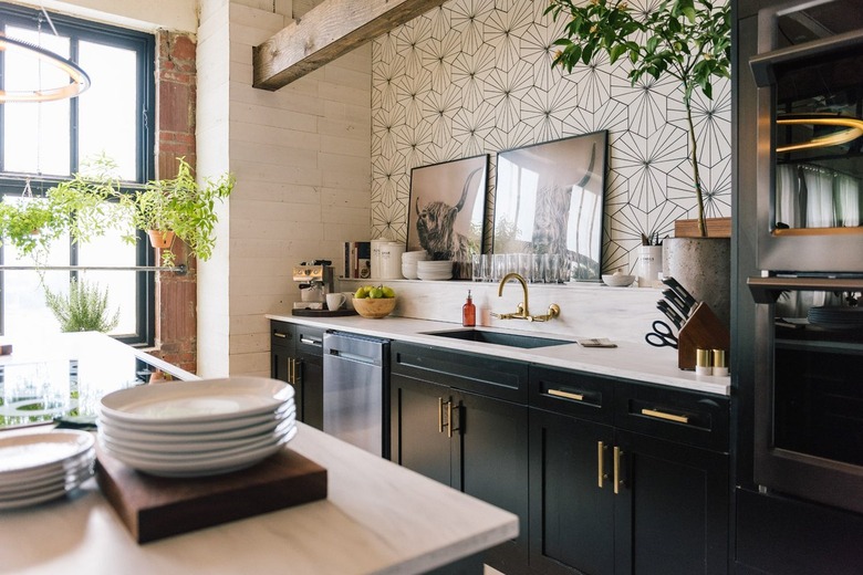 industrial kitchen in loft with patterned tile backsplash