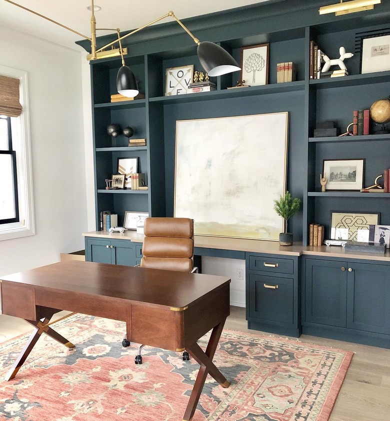 industrial office idea with blue painted built-ins in home office