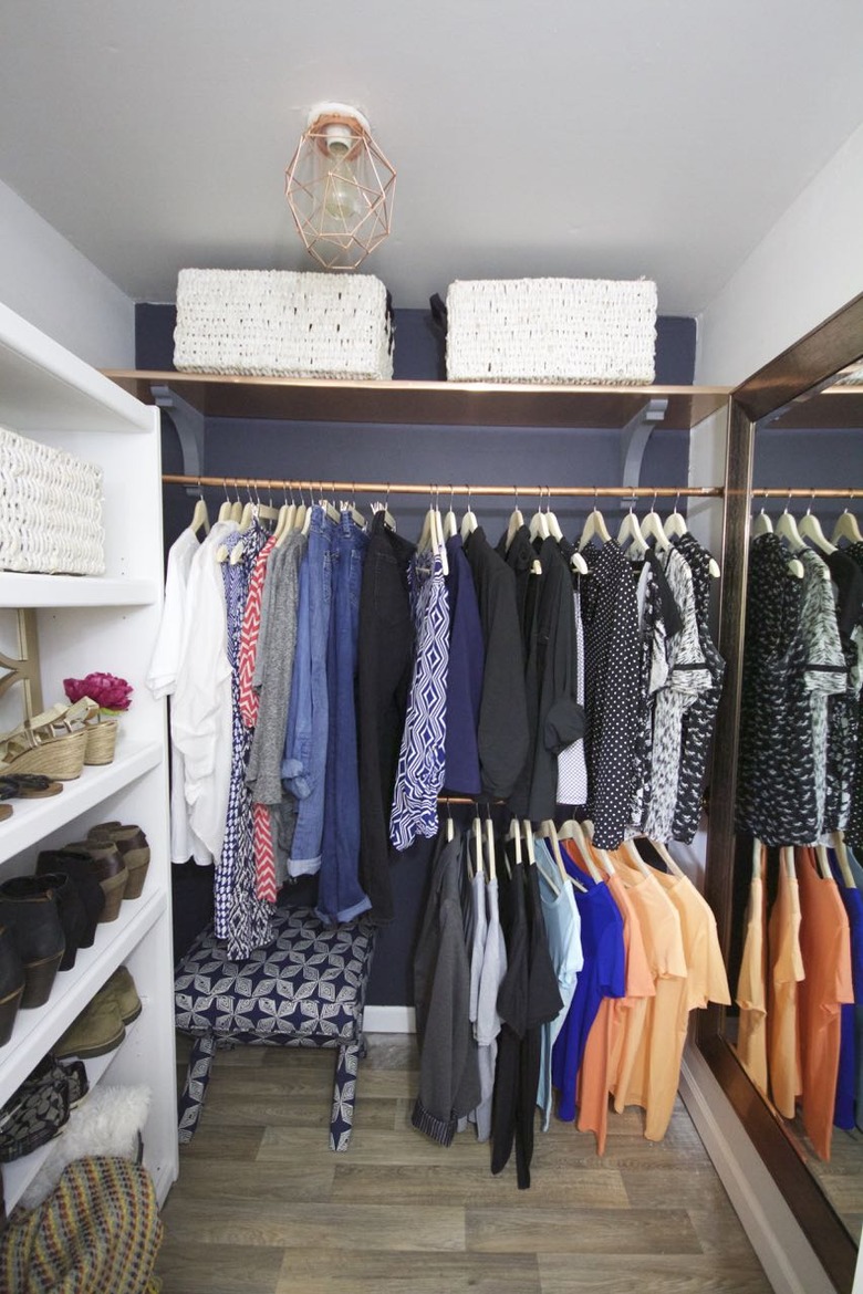 Copper industrial pipe closet idea with matching copper ceiling light